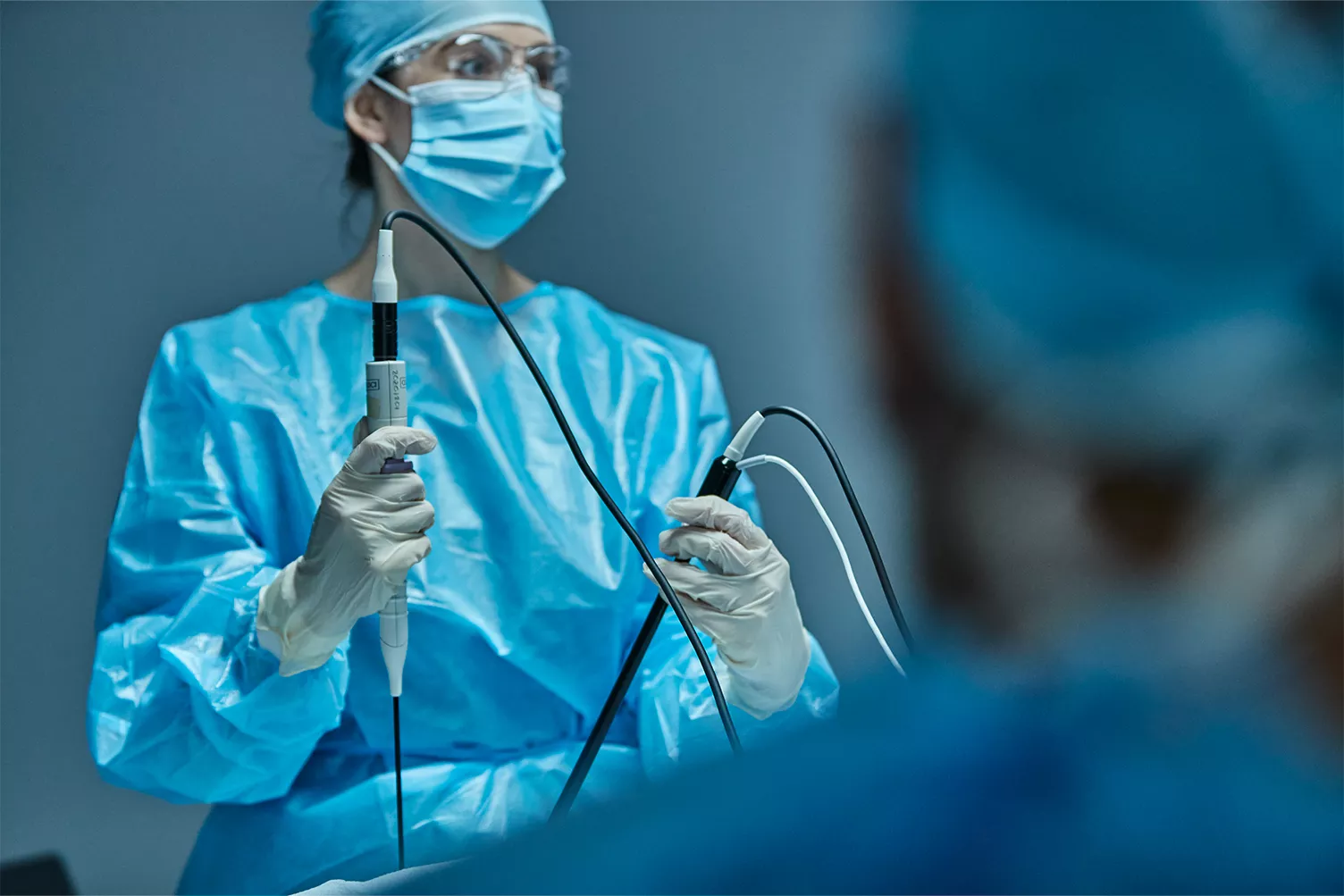 Female doctor preforming the Acessa Laparoscopic Radiofrequency Ablation surgery